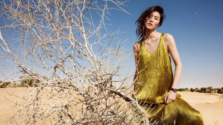 Sparkling in pleats, Liu Wen wears Haider Ackermann maxi dress with Chanel watch