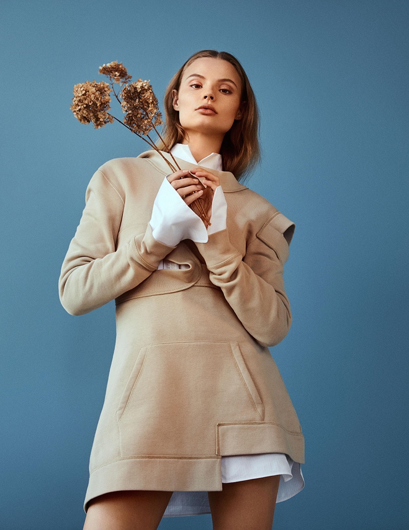 Magdalena Frackowiak poses in cutout dress and shirt from Burberry