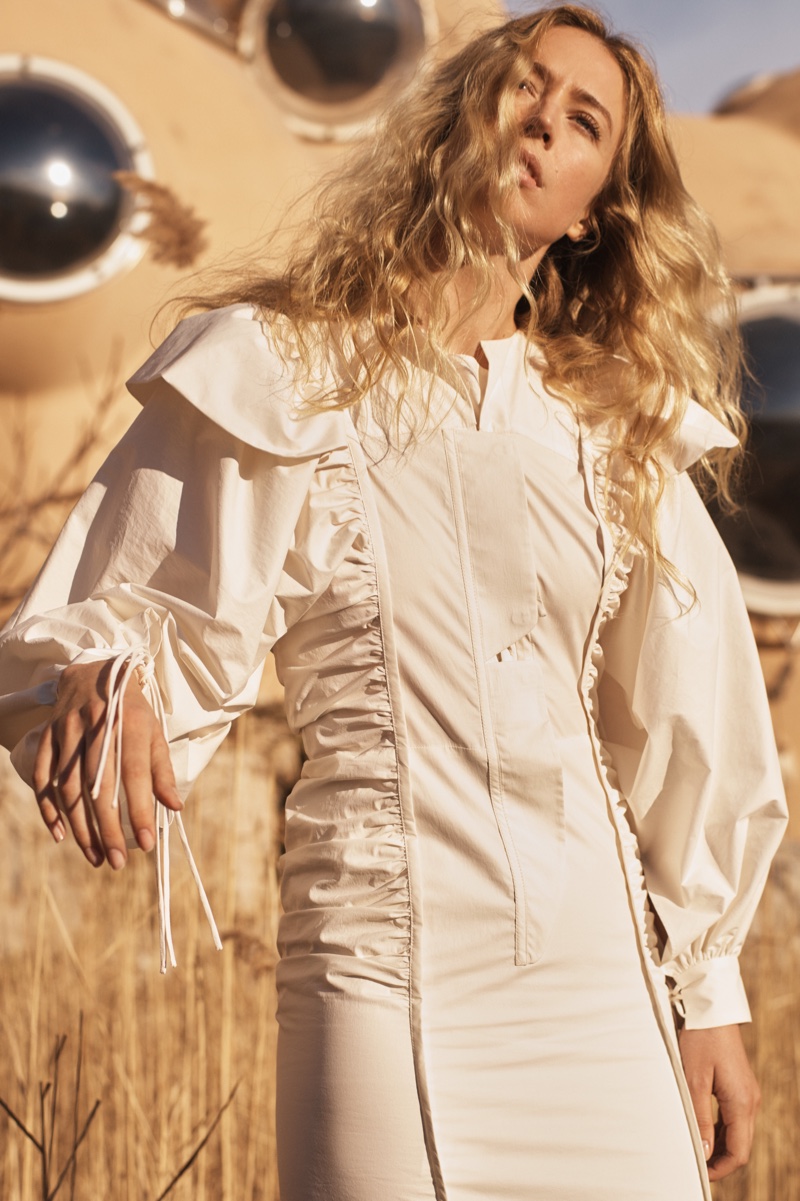 Raquel Zimmermann wears white dress with ruching from Mango Committed collection
