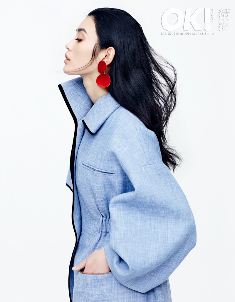 Ming Xi models denim coat and red drop earrings