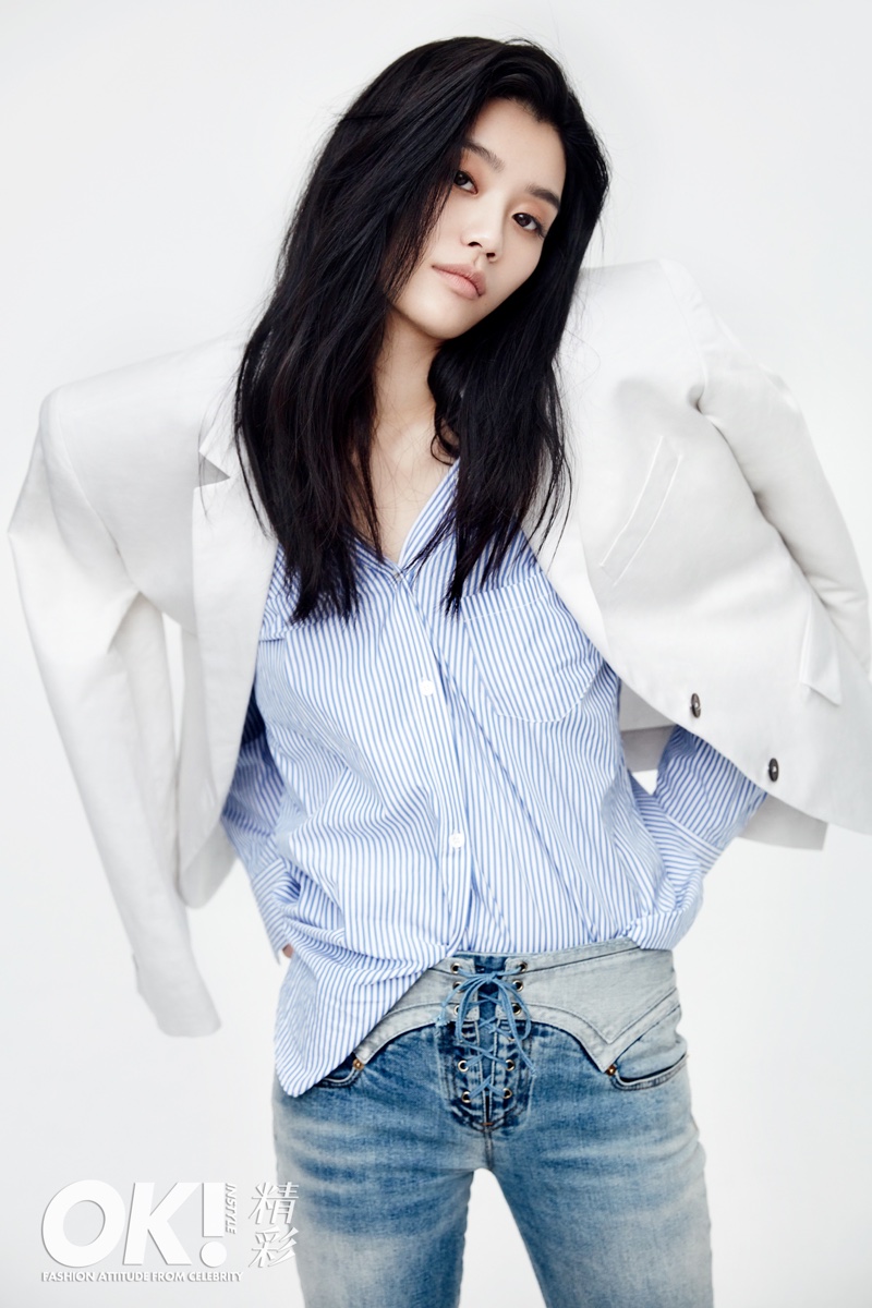 Ming Xi wears white blazer, striped shirt and lace-up jeans