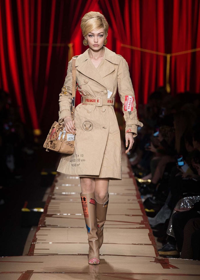 Gigi Hadid wears cardboard inspired trench coat from Moschino’s fall-winter 2017 collection