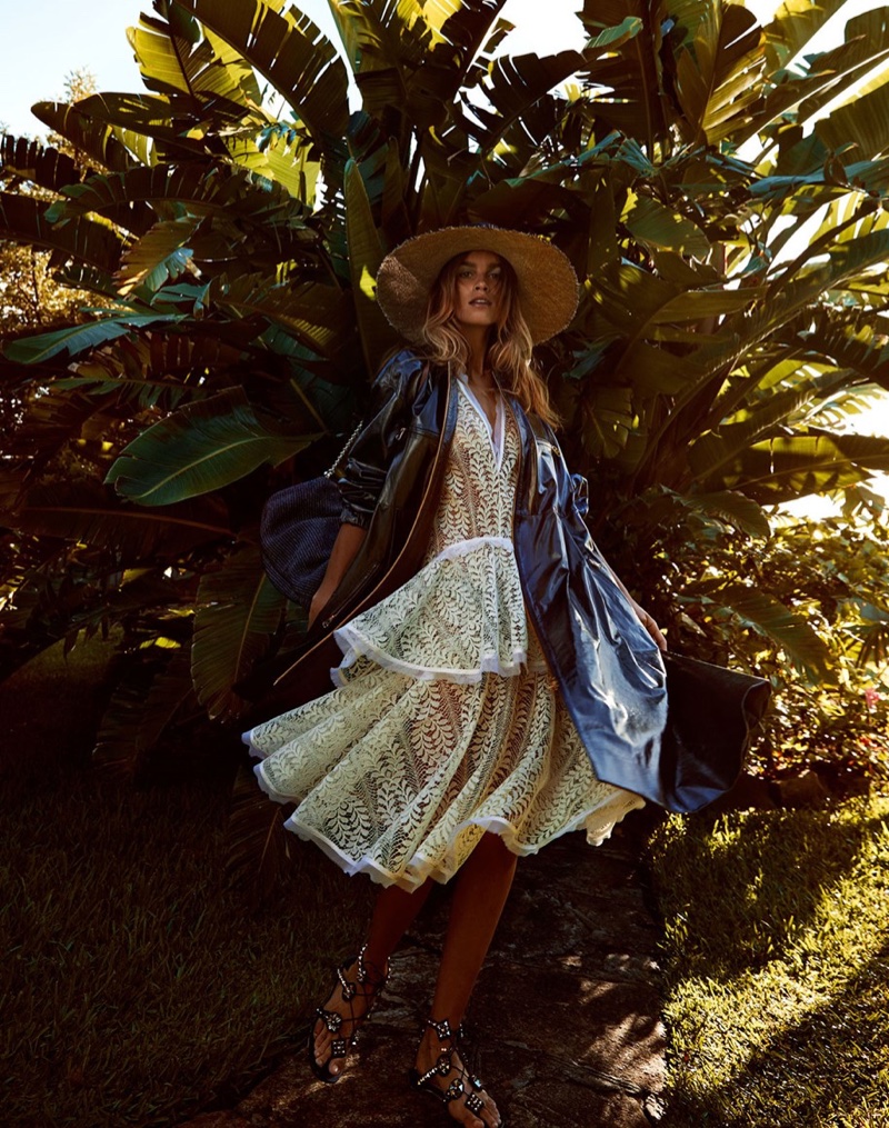 Catching some shade, Olivia Aarnio poses in Lover midi dress, Dior coat, Christian Louboutin flat and Hat Maker sunhat