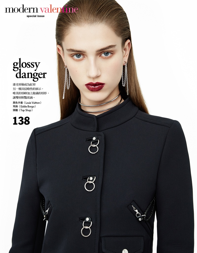 Model Sabina Lobova poses in Louis Vuitton embellished coat