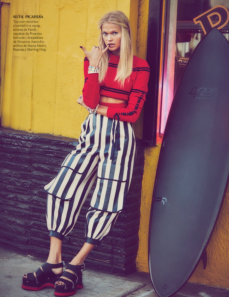 Vita Sidorkina models Fendi cropped top and striped pants with Proenza Schouler shoes