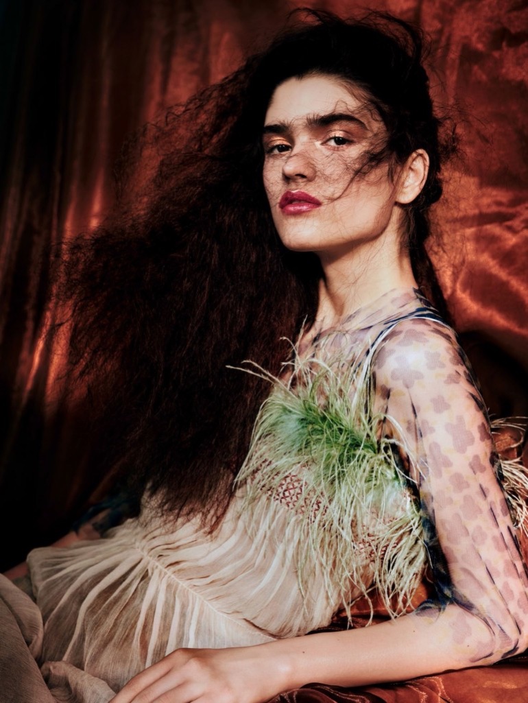 Alexandra Micu models Prada top with feathers