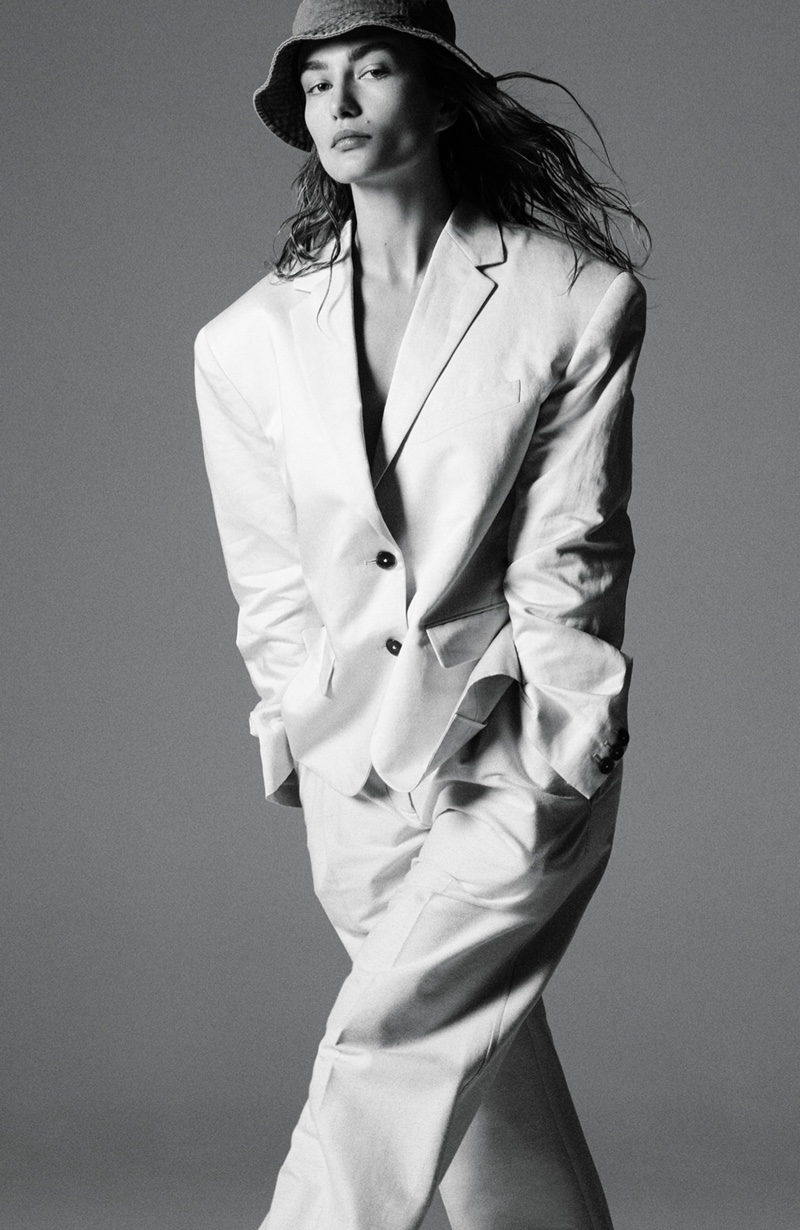 Andreea Diaconu models Jil Sander jacket, Oscar de la Renta pants and House of Lafayette hat