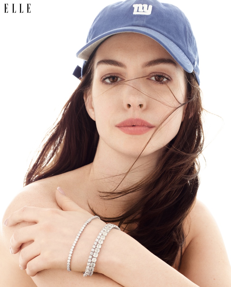 Anne Hathaway wears Bulgari bracelets, Chopard bracelet and ’47 baseball cap