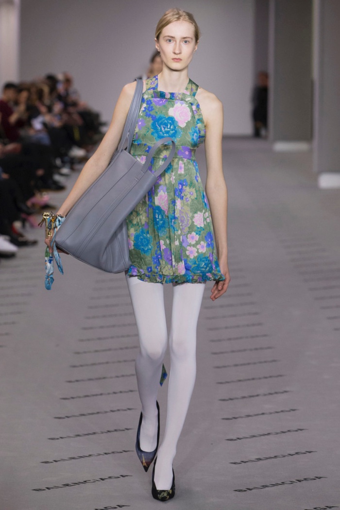 Floral print apron dress with large tote bag from Balenciaga’s fall-winter 2017 collection