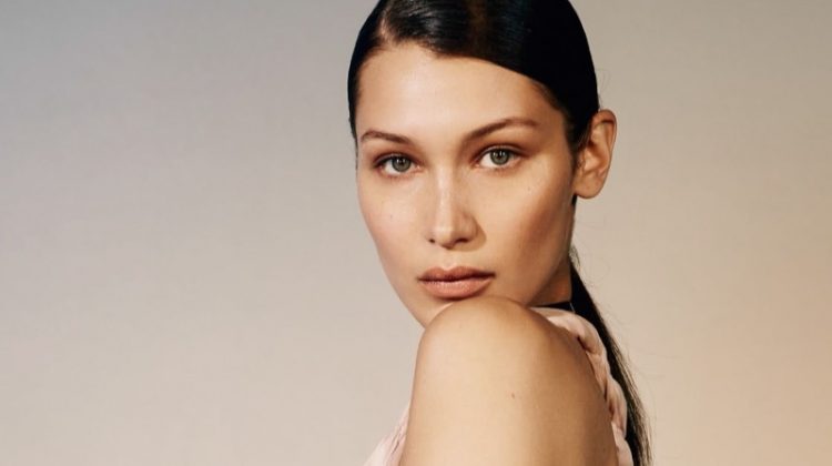 Looking pretty in pink, Bella Hadid poses in pleated Dior dress