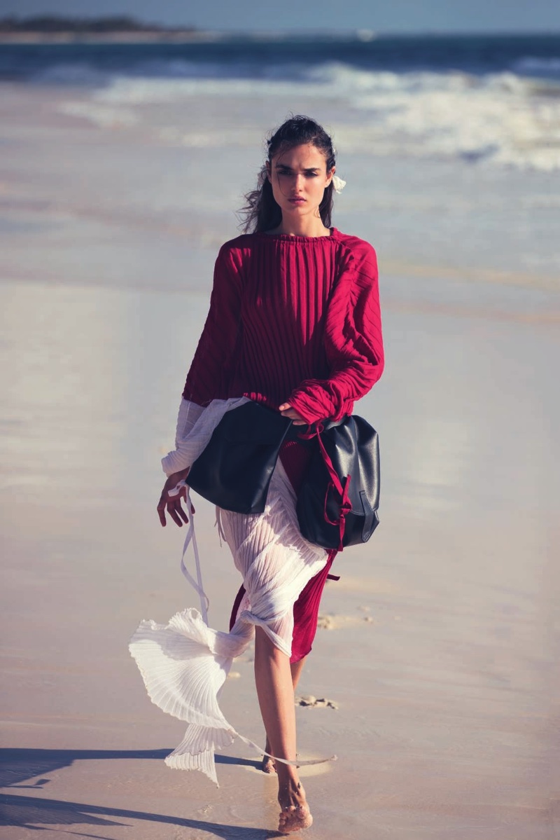 Blanca Padilla models Marni bicolor dress with pleats and belt with bags