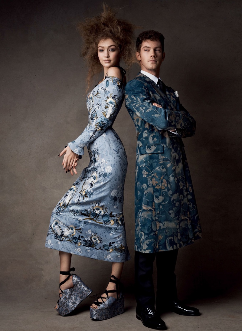 Dressed in an Erdem dress and platform sandals, Gigi Hadid models alongside Alistair Brammer