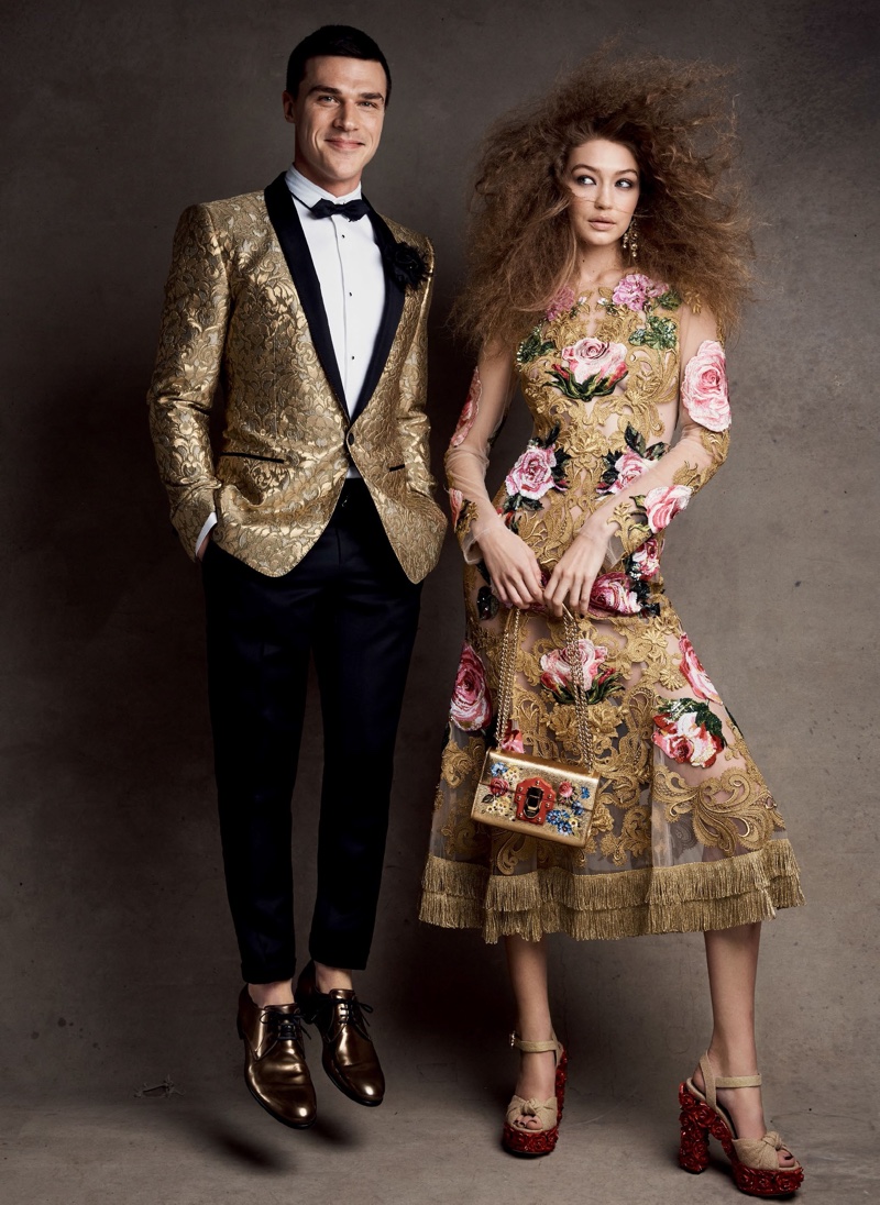 Shining in gold, Gigi Hadid models Dolce & Gabbana dress, earrings, bag and sandals