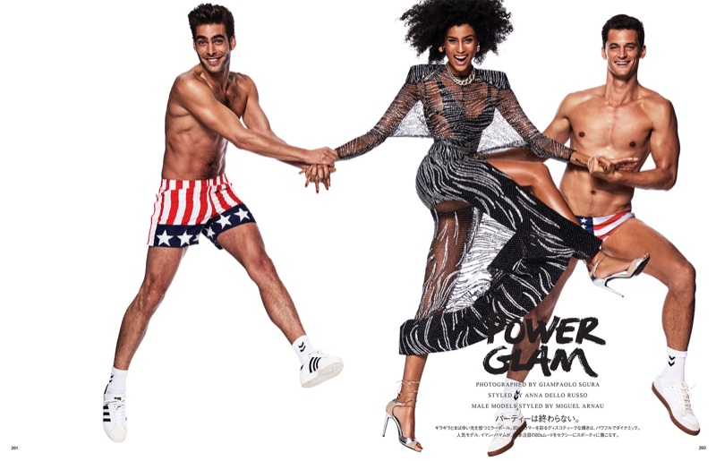 Imaan Hammam poses with male models Jon Kortajarena and Garrett Neff