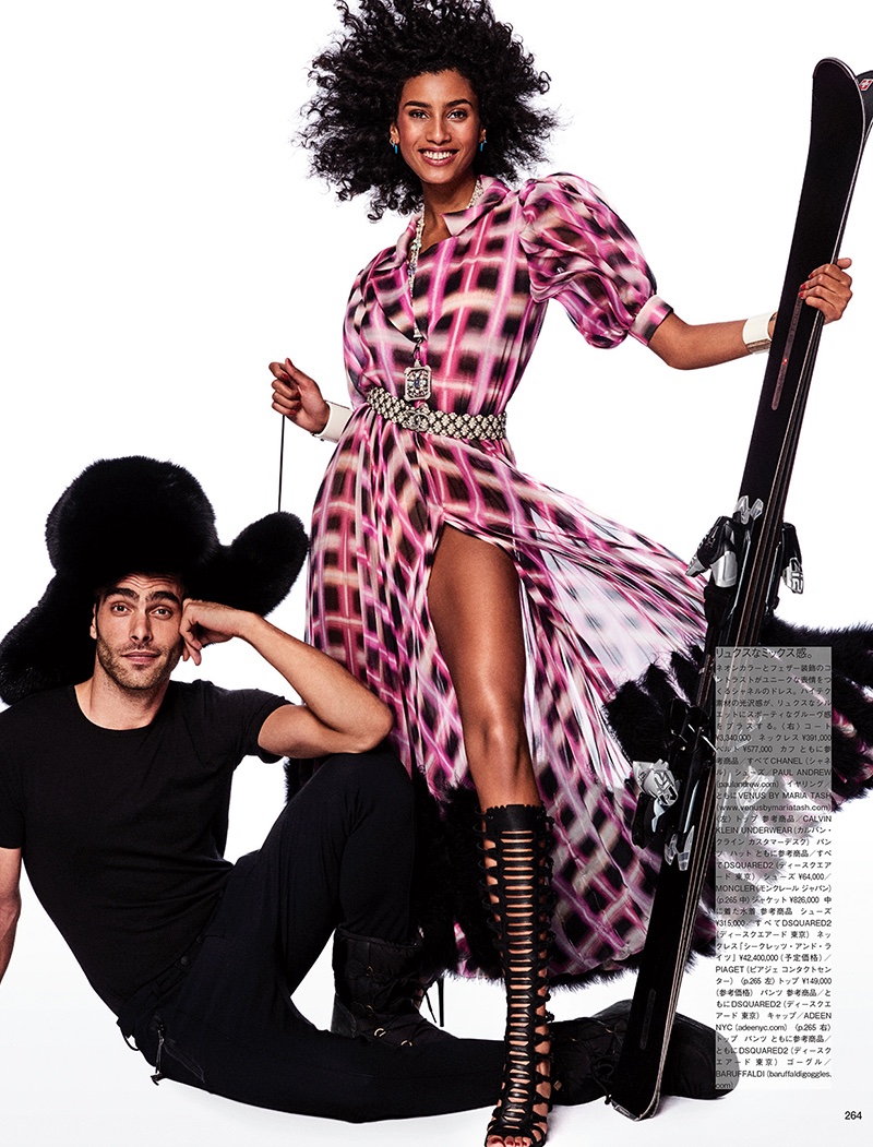 Modeling with skis, Imaan Hammam wears Chanel dress and Paul Andrew sandals