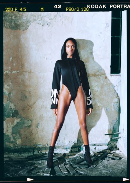 Jourdan Dunn wears Londunn x Missguided Black Wide Sleeve White Logo Bodysuit $54