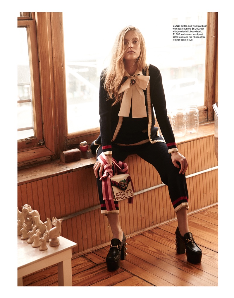 Mirte Maas models Gucci cardigan, top, pants, leather bag and platform shoes
