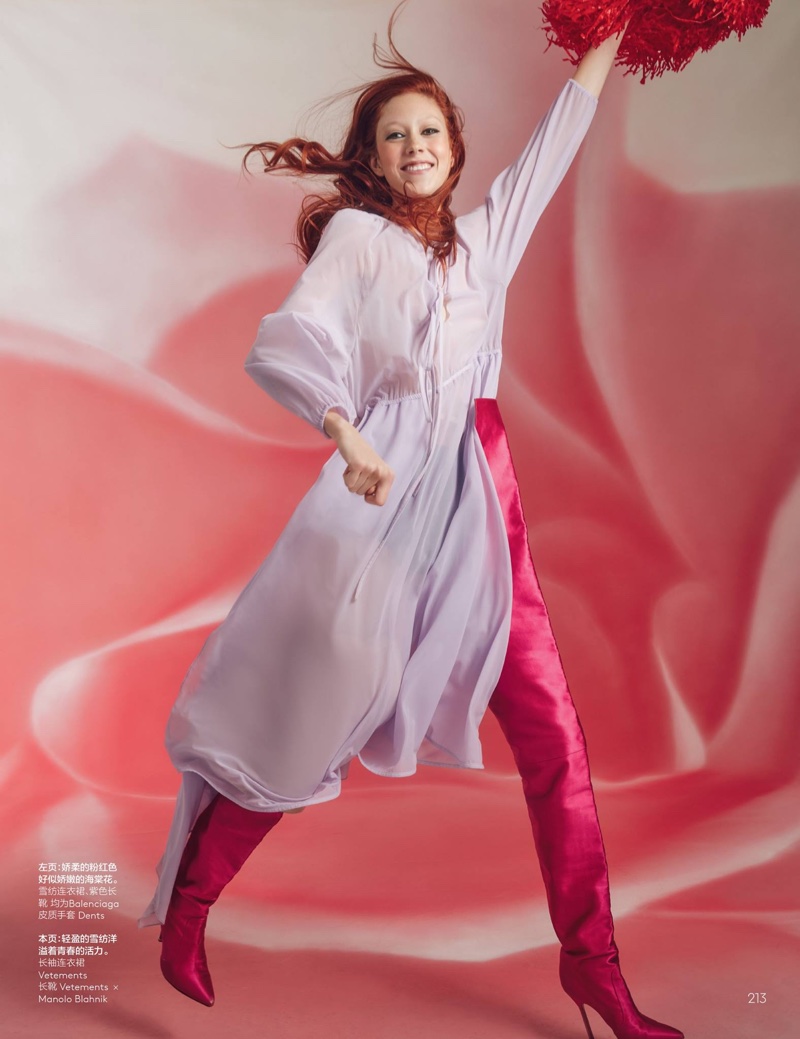 Doing a cheer, Natalie Westling poses in Vetements dress over Vetements x Manolo Blahnik boots