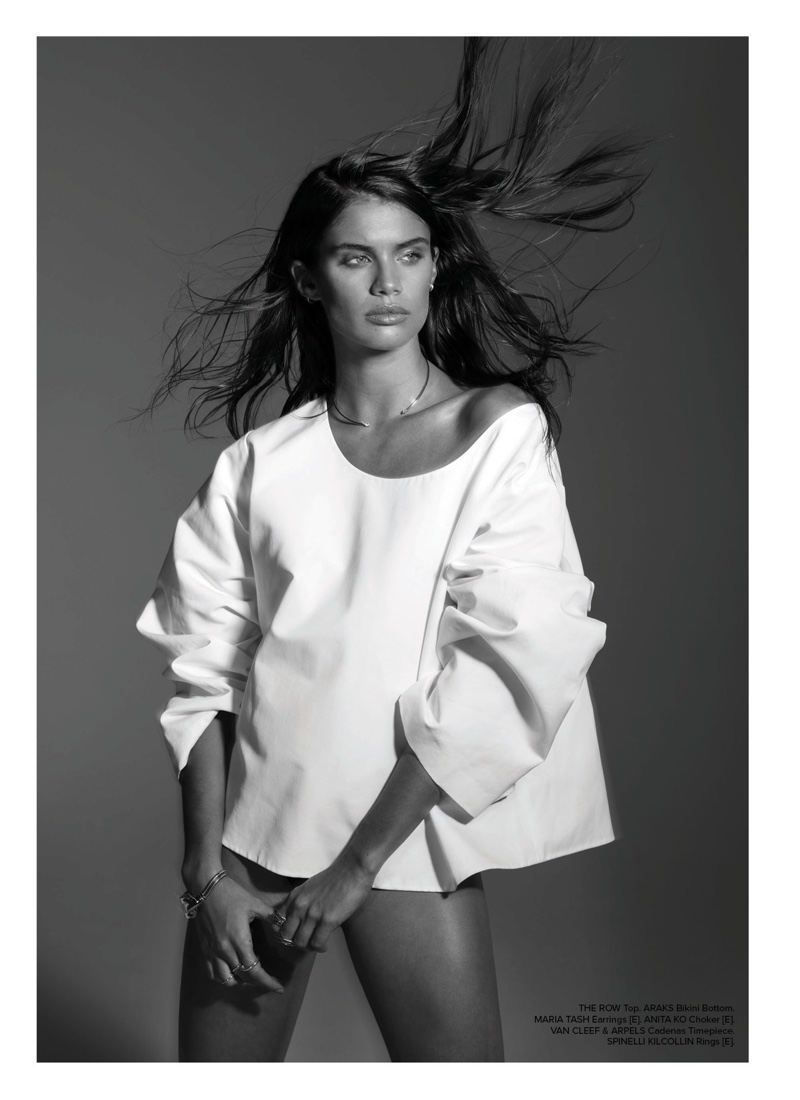 Photographed in black and white, Sara Sampaio models The Row top and Araks bikini bottoms