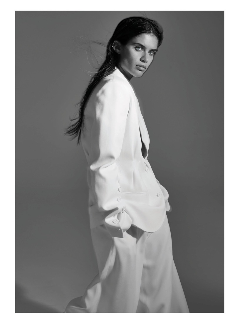Model Sara Sampaio suits up in white jacket and pants from Michael Kors Collection
