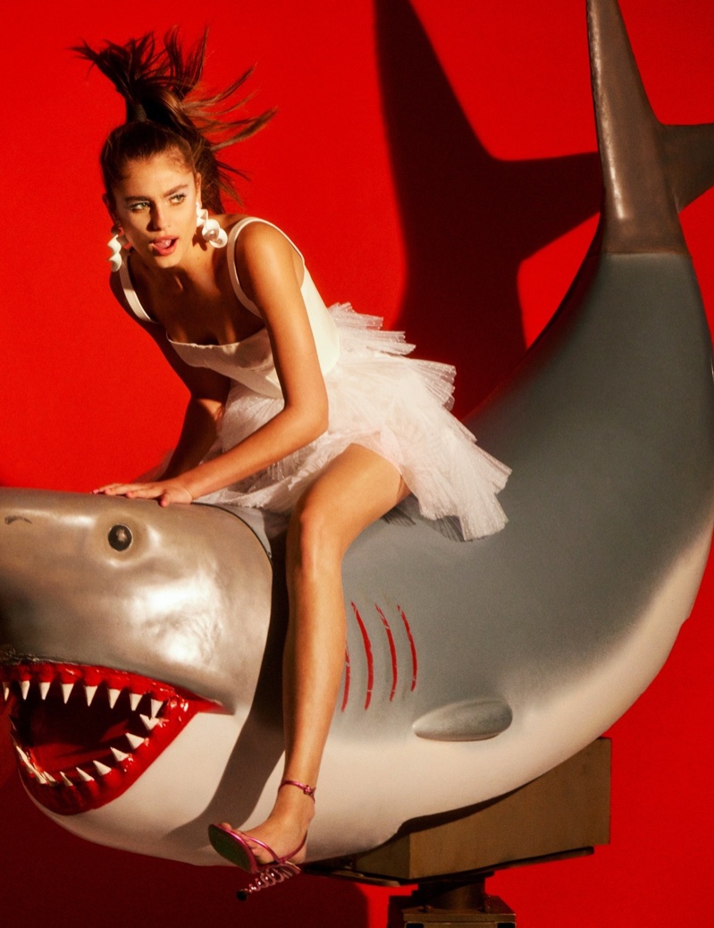 Posing on a shark, Taylor Hill models tulle Dior dress