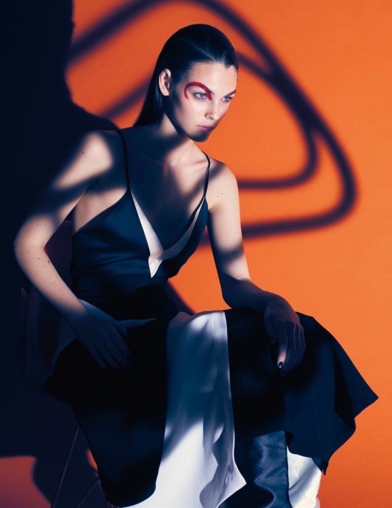 Posing in the shadows, Vittoria Ceretti models bi-color dress