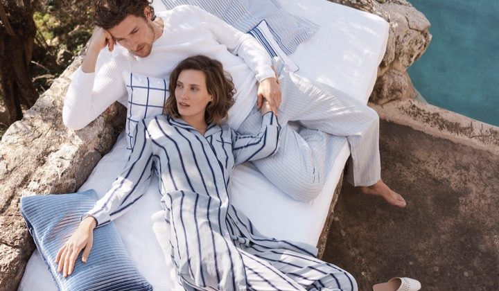 Lounging outdoors, Drake Burnette wears striped pajama separates from Zara Home