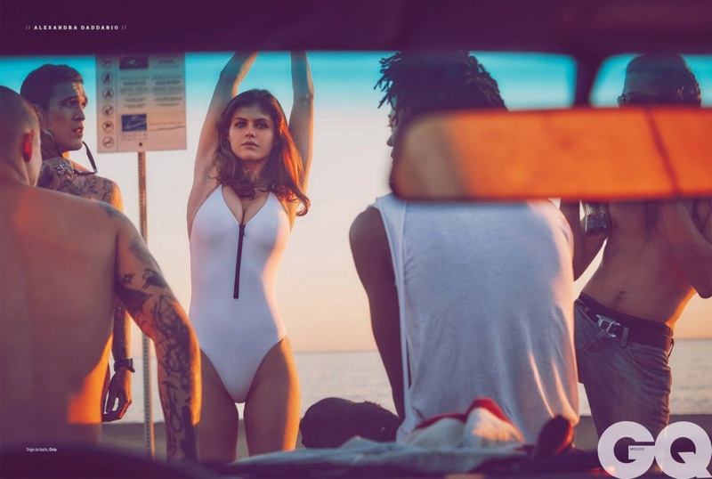 Posing on the beach, Alexandra Daddario wears Onia swimsuit