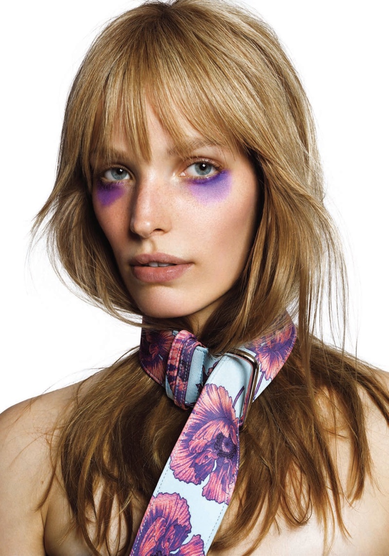 Wearing purple eyeshadow, Alisa Ahmann wears Altuzarra belt as a scarf