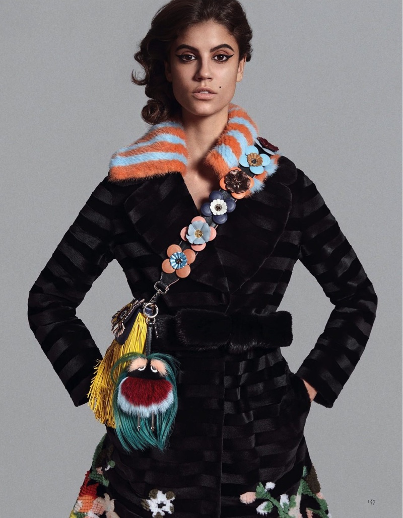 Antonina Petkovic models Fendi mink coat and fringe bag with floral embellished guitar strap