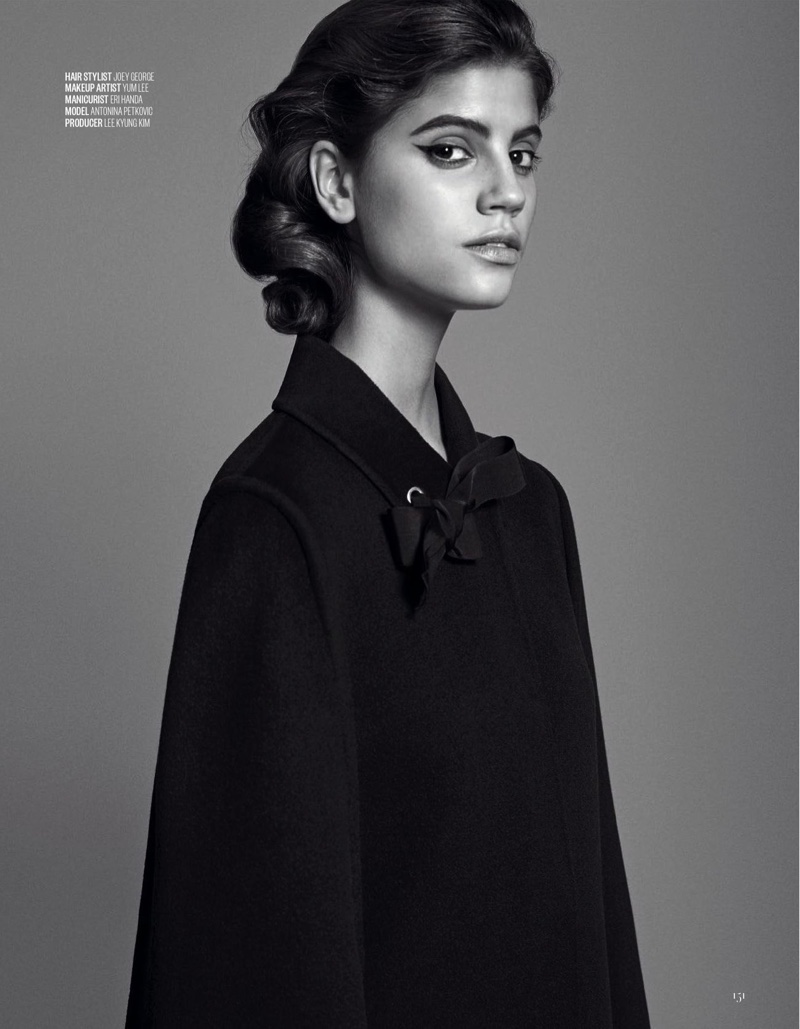 Photographed in black and white, Antonina Petkovic models Fendi black cape and bow