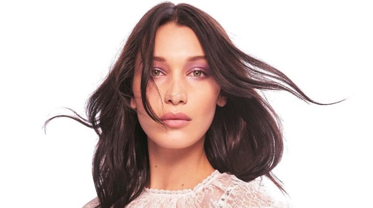 Model Bella Hadid wears lace Dior top and bandeau bralette