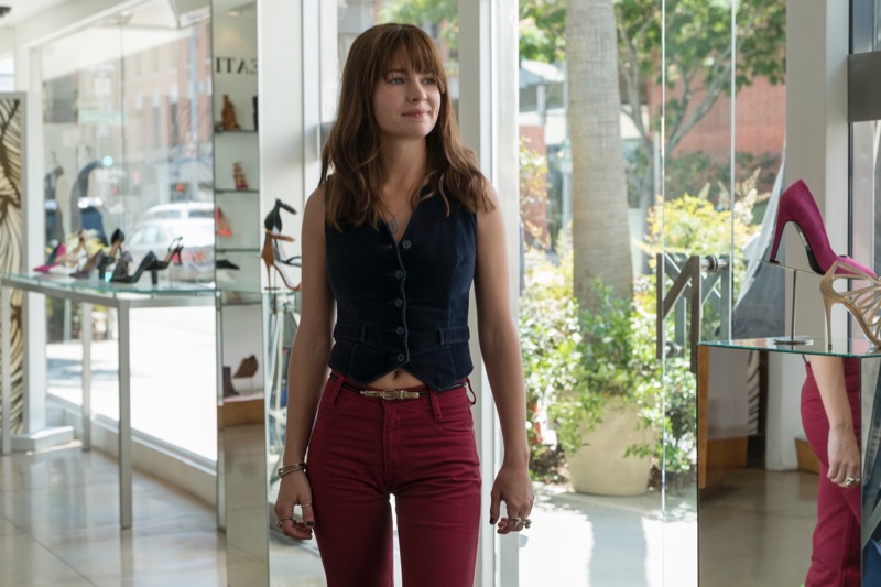 Britt Robertson wears a 70's inspired vest and red jeans in Girlboss. Photo: Netflix