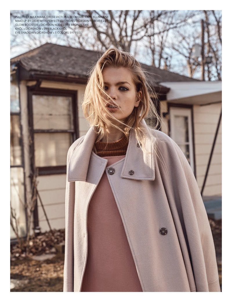 Model Daphne Groeneveld wears Max Mara sweater, Victoria Beckham dress and Blumarine cape