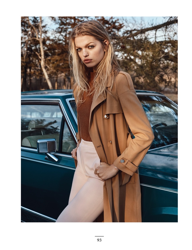 Daphne Groeneveld poses in Ralph Lauren sweater, Elisabetta Franchi trench and Dior trousers