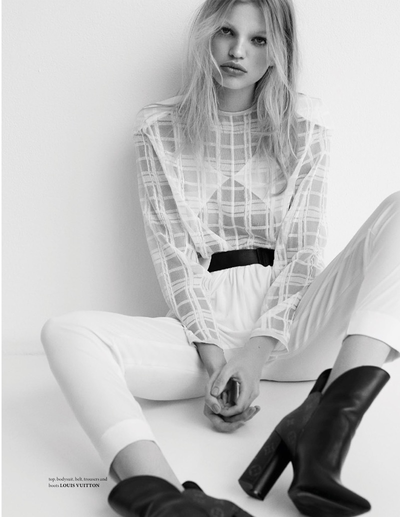 Photographed in black and white, Daphne Groeneveld models Louis Vuitton top, bodysuit, belt, pants and boots