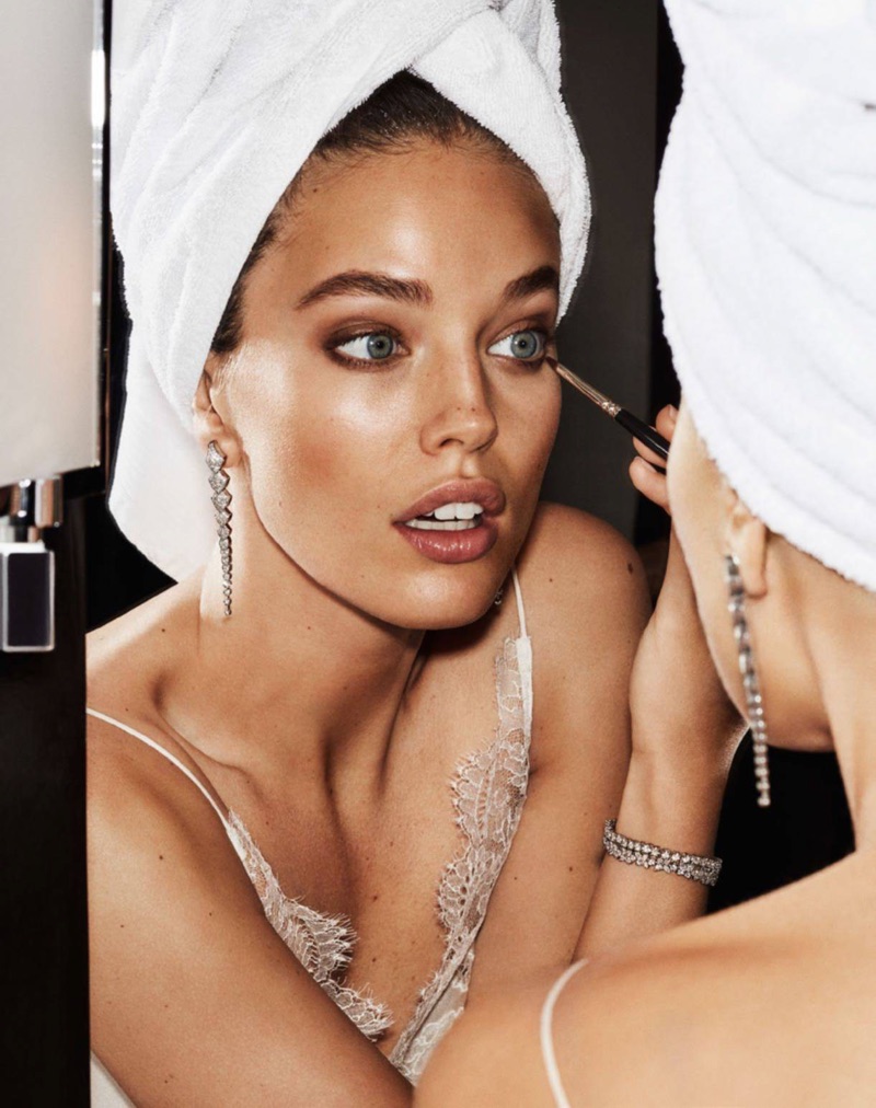 Primping in the mirror, Emily DiDonato wears Carine Gilson camisole, Akillis earrings, Tiffany & Co. bracelet and Bulgari bracelet