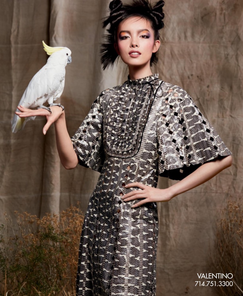 Fei Fei Sun models Valentino dress with winged sleeves