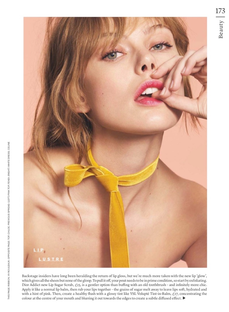 Model Frida Gustavsson wears a berry colored lip gloss