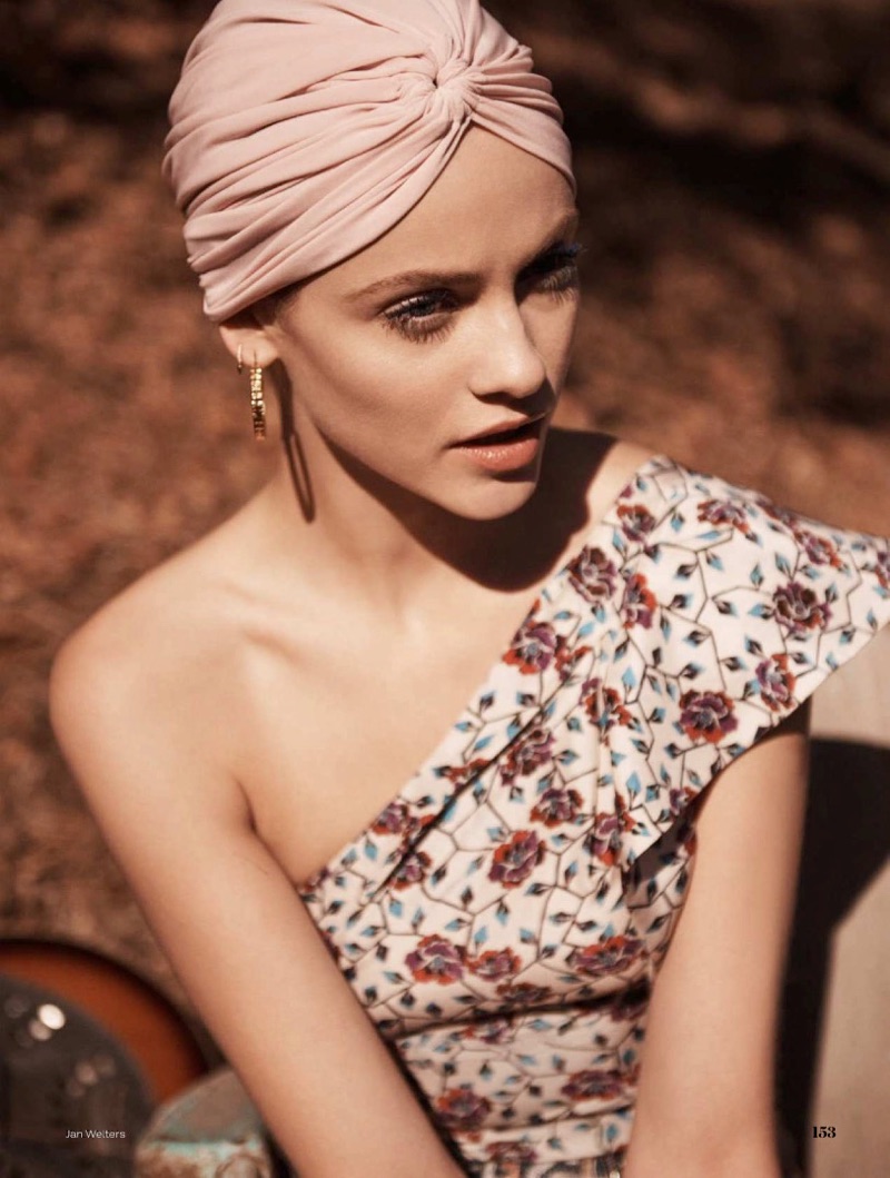 Getting her closeup, Ginta Lapina models Isabel Marant silk top and Norma Kamali jersey turban