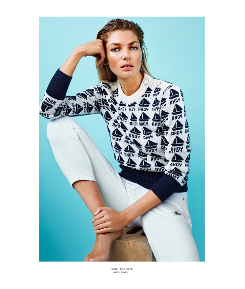 Keeping it casual, Jessica Hart poses in Tory Burch sweater and Levi’s jeans