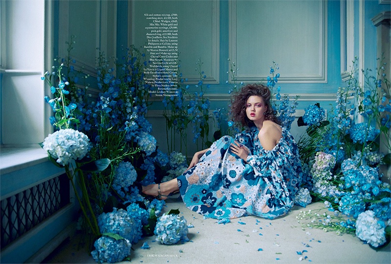 Surrounded by florals, Lindsey Wixson poses in Chloe silk and cotton mix top with matching skirt. Wedges by Miu Miu.