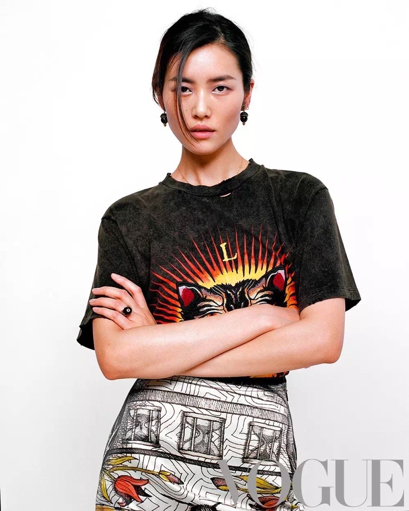 Keeping it casual, Liu Wen models Gucci t-shirt and skirt