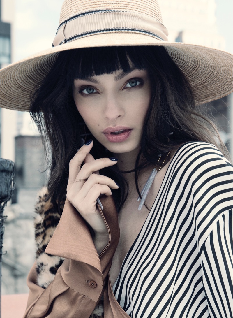 Getting her closeup, Luma Grothe models wide-brimmed hat with bangs