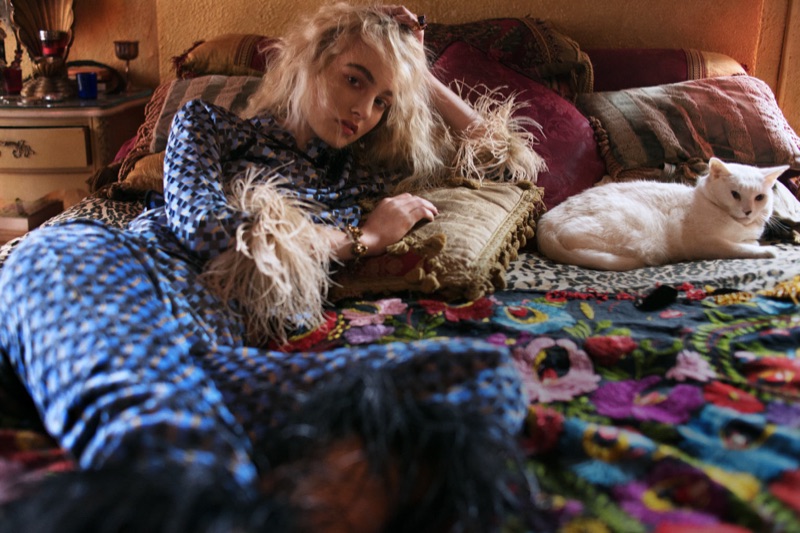 Lounging in bed with a cat, Maartje Verhoef poses in Prada top and pants