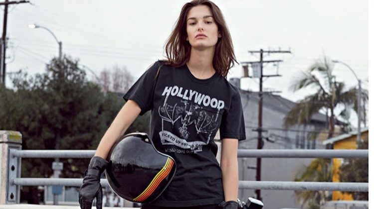 Posing next to a motorcycle, Ophelie Guillermand wears Local Authorities t-shirt, Seafarer jeans and Zadig & Voltaire boots