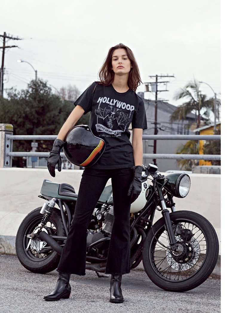 Posing next to a motorcycle, Ophelie Guillermand wears Local Authorities t-shirt, Seafarer jeans and Zadig & Voltaire boots