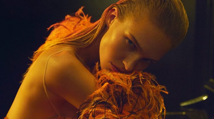 Embracing feathers, Sasha Luss models Armani Prive top, scarf and skirt