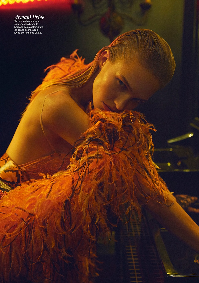 Embracing feathers, Sasha Luss models Armani Prive top, scarf and skirt