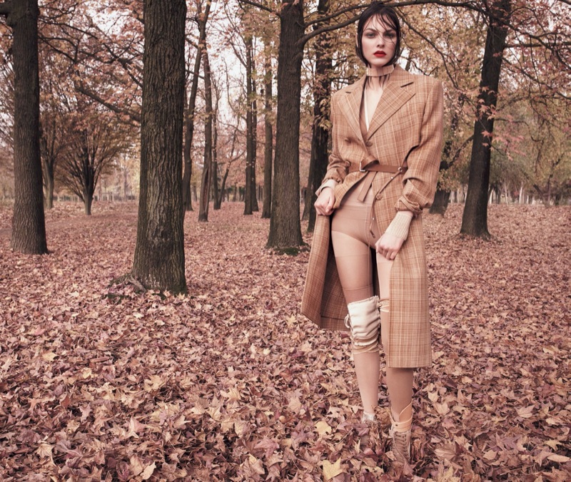 Posing in the woods, Vittoria Ceretti models Celine coat with Fenty by Puma heels
